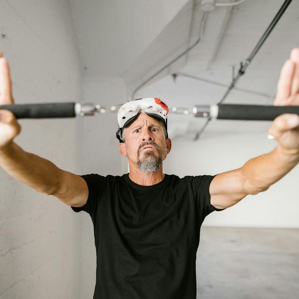 Close-up of a person's focused expression during a controlled movement.